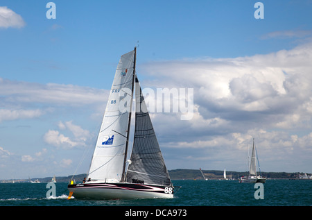 The French yacht Earwen competing in the 2013 Rolex Fastnet race rounding Hurst Spit Keyhaven Hampshire Stock Photo