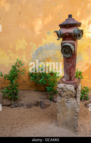 Old Fire Hydrant on a Residential Street, Goree Island, Senegal. Stock Photo