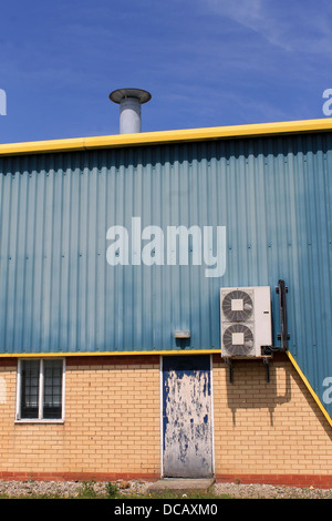 Air conditioing unit on exterior of warehouse building. Stock Photo