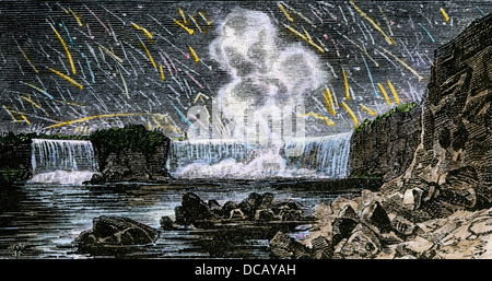 Intense meteor shower seen over Niagara Falls in 1833. Hand-colored woodcut Stock Photo