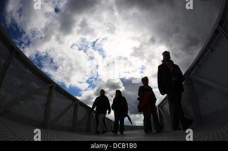 Chinese tourists take souvenir pictures on the horizon path in Hamburg, Germany, 14 August 2013. Photo: CHRISTIAN CHARISIUS Stock Photo