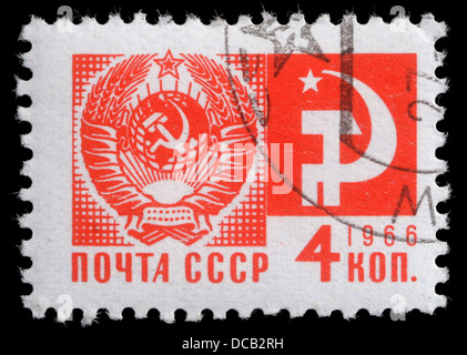 Stamp printed in USSR from the 'Society and Technology' issue shows the Coat of Arms and communism emblem, circa 1966. Stock Photo