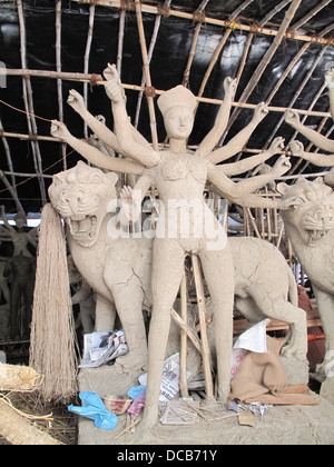 construction of the Goddess Durga made with straw and covered in mud before it is finally painted Stock Photo