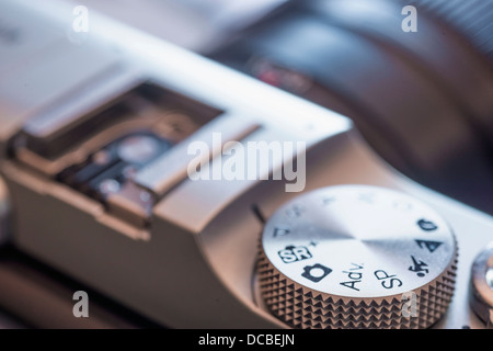Macro close up photograph of mode dial wheel on top of the Fuji X-M1 digital camera Stock Photo