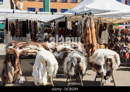 Reindeer fur skins for sale as gifts for tourists on a stall in Fish Market on Torget, Bergen, Hordaland, Norway, Scandinavia Stock Photo