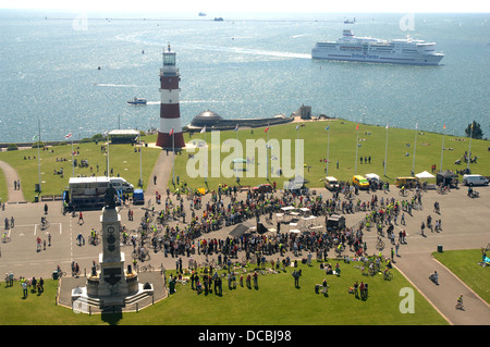 A ferry comes into Plymouth as people enjoy themselves on Plymouth Hoe. Stock Photo