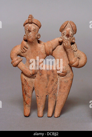 The 'Joined Couple' sculpture, housed at the Los Angeles County Museum of Art, is a bronze cast depiction of an ancient Egyptian couple. It is a fine example of Egyptian amulets and jewelry, showcasing detailed craftsmanship in bronze and stone. This piece is part of LACMA's extensive collection that also features ancient artifacts from Latin America, Japan, and the Near East. Stock Photo