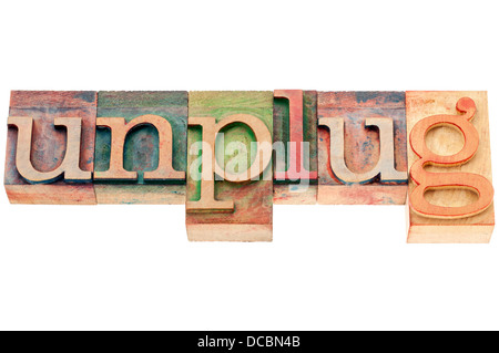 unplug - lifestyle or information overload concept - isolated text in letterpress woodtype Stock Photo