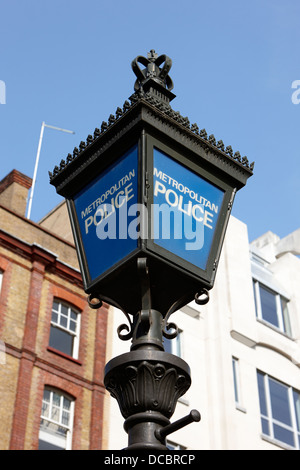 metropolitan police blue lamp sign outside a police station London England UK Stock Photo