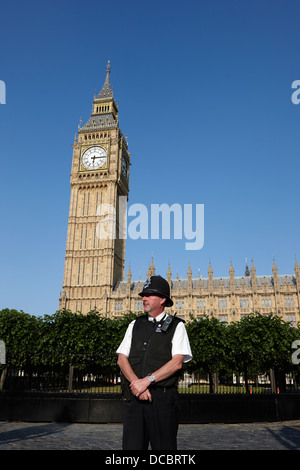 british metropolitan police office guarding the houses of parliament London England UK Stock Photo