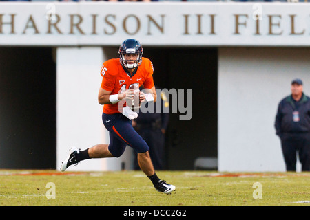 Virginia Cavaliers quarterback Michael Rocco (16) scrambles out of the pocket against the Georgia Tech Yellow Jackets during the Stock Photo