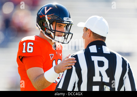 Virginia Cavaliers quarterback Michael Rocco (16) talks to NCAA referee David Epperley before the game against the Georgia Tech Stock Photo