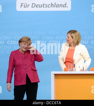 Ludwigshafen, Germany. 14th Aug, 2013. German chancellor Angela Merkel (CDU, L) takes part in an election campaign event in Ludwigshafen, Germany, 14 August 2013. To her right stands Julia Kloeckner, CDU chairwoman and faction leader in the state parliament of Rhineland-Palatinate. Germany holds federal elections on 22 September 2013. Photo: ULI DECK/dpa/Alamy Live News Stock Photo