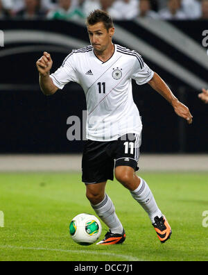 Kaiserslautern, Germany. 14th Aug, 2013. Germany's Miroslav Klose runs with the ball during the soccer match between Germany and Paraguay, Fritz Walter stadium in Kaiserslautern on August 14, 2013. © dpa picture alliance/Alamy Live News Stock Photo