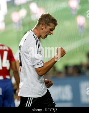 Kaiserslautern, Germany. 14th Aug, 2013. Germany's Lars Bender celebrates scoring the 3:3 during the soccer match between Germany and Paraguay, Fritz Walter stadium in Kaiserslautern on August 14, 2013. © dpa picture alliance/Alamy Live News Stock Photo