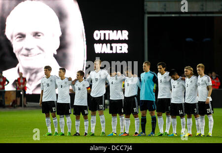 Kaiserslautern, Germany. 14th Aug, 2013. German players remember former national player Ottmar Walter during the soccer match between Germany and Paraguay, Fritz Walter stadium in Kaiserslautern on August 14, 2013. © dpa picture alliance/Alamy Live News Stock Photo