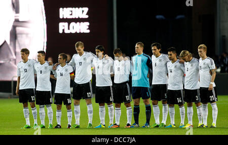 Kaiserslautern, Germany. 14th Aug, 2013. Germany's stand together for Heinz Flohe during the soccer match between Germany and Paraguay, Fritz Walter stadium in Kaiserslautern on August 14, 2013. © dpa picture alliance/Alamy Live News Stock Photo