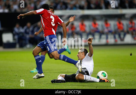 Kaiserslautern, Germany. 14th Aug, 2013. Germany's Miroslav Klose falls against Paraguay's Salustiano Candia during the soccer match between Germany and Paraguay, Fritz Walter stadium in Kaiserslautern on August 14, 2013. © dpa picture alliance/Alamy Live News Stock Photo