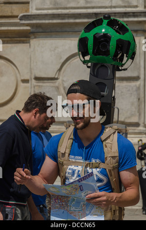 A man employed by Google to map the Streets and Canals of Venice, Italy on foot  using the Google Trekker Backpack. Stock Photo
