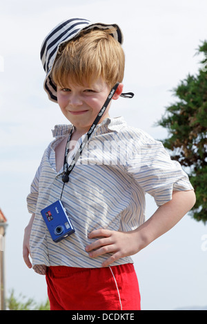 portrait of a young boy with a digital camera Stock Photo