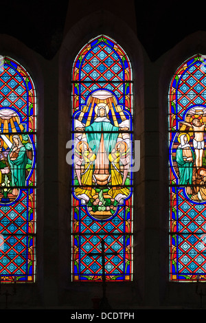 Stained glass window in church at Le Menoux, Limousin, France. Stock Photo