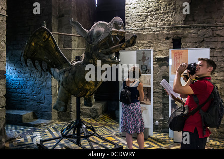 Tourists looking at original copper dragon from the top of the Ghent Belfry tower, East Flanders, Belgium Stock Photo