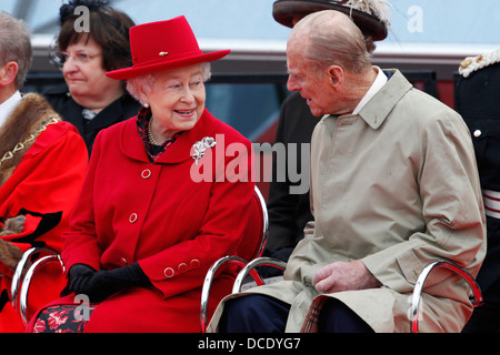 Britain's Queen Elizabeth II (L) and Prince Philip, Duke of Edinburgh during the re-opening of the restored Cutty Sark Stock Photo