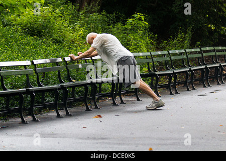 Senior Man stretching in Central Park Stock Photo