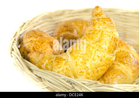 close up croissants in wooden basket Stock Photo