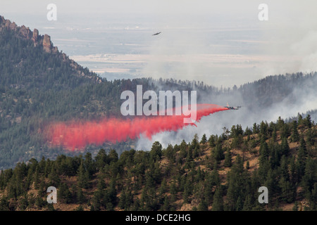 USA, Colorado, Boulder, Flagstaff Fire, Pilot Plane with Slurry Bomber Dropping Fire Retardant on the Forest Fire. Stock Photo