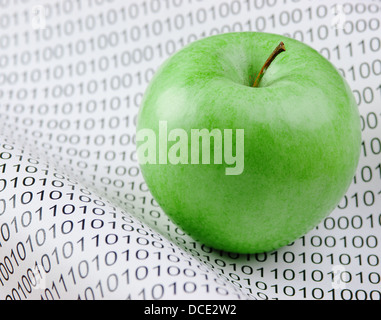 green apple on a binary code Stock Photo - Alamy