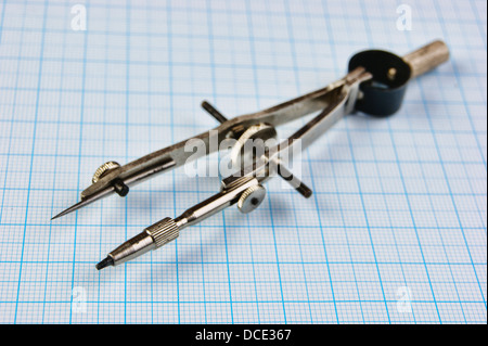 Old drawing tools on graph paper Stock Photo