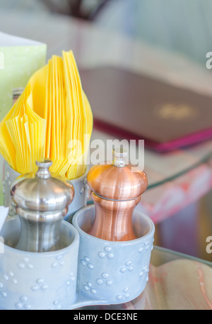 Closeup view of salt and pepper pots in cafe Stock Photo