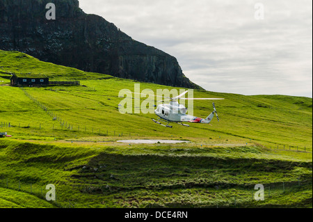 Helicopter landing in Mykines in the Faroe Islands Stock Photo