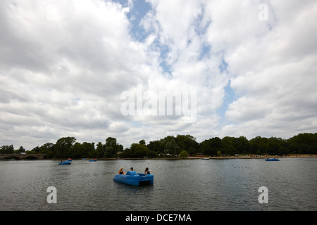 boating on the serpentine in cloudy weather hyde park London England UK Stock Photo