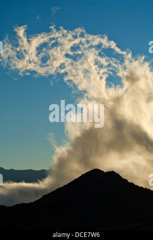 Cloud rising out of the Owens Valley at sunrise, Eastern Sierra, California Stock Photo
