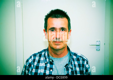 Portrait of slightly startled looking middle aged man Stock Photo