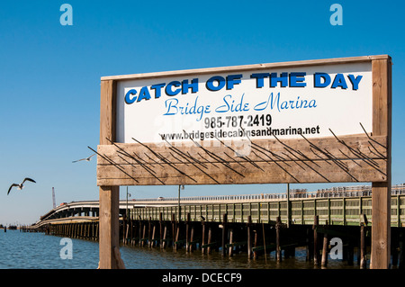 USA, Louisiana, Atchafalaya Basin, Grand Isle, Bridgeside Marina, bridge from Leeville behind. Stock Photo