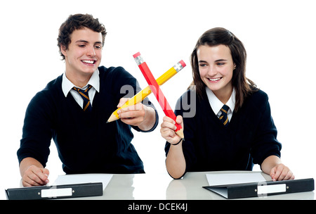 Classmates engaged in a mock fight after completing the test Stock Photo