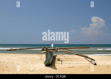 FIBREGLASS FISHING BOAT BENTOTA BEACH SRI LANKA 14 March 2013 Stock Photo