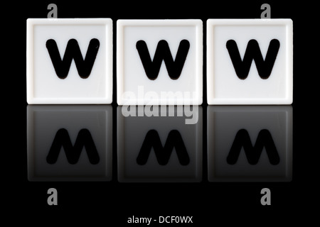 WWW spelled in game letters reflected on isolated black background Stock Photo