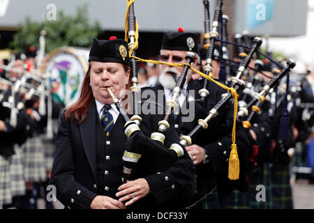 Saint Enoch Square, Glasgow, Scotland, UK, Friday, 16th August, 2013. Pipe Major Bethany Bisaillion leads Sons Of Scotland Pipe Band from Ottawa, Canada as four pipe bands take part in the traditional Beat The Retreat during the Piping Live! Festival. Stock Photo