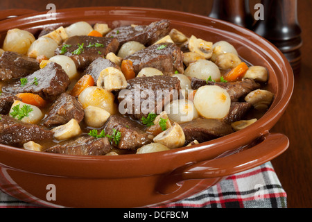 Beef Bourguignon - classic French stew, beef bourguignon, beef cooked in red wine with onions, mushrooms, bacon and carrots. Stock Photo