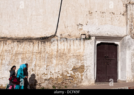 Women walking on the streets of Moulay Idriss medina. Morocco Stock Photo