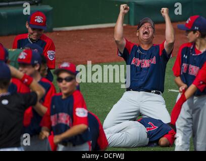 Aberdeen, Maryland, USA.16th Aug, 2013.  - New England coach Paul Gesualdi celebrates after hanging on for the win during the New England (New Milford, CT) versus Mid-Atlantic (Hockessin, DE) matchup on Playoff Semifinals Day at the Cal Ripken World Series in Aberdeen, Maryland on August 15, 2013. New England defeated Mid-Atlantic 5-4. Credit:  ZUMA Press, Inc./Alamy Live News Stock Photo