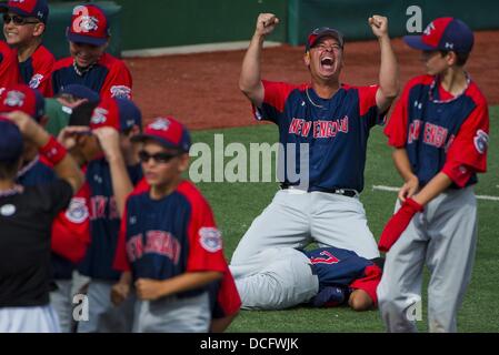 Aberdeen, Maryland, USA.16th Aug, 2013.  - New England coach Paul Gesualdi celebrates after hanging on for the win during the New England (New Milford, CT) versus Mid-Atlantic (Hockessin, DE) matchup on Playoff Semifinals Day at the Cal Ripken World Series in Aberdeen, Maryland on August 15, 2013. New England defeated Mid-Atlantic 5-4. Credit:  ZUMA Press, Inc./Alamy Live News Stock Photo