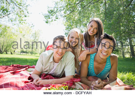 Portrait of happy teenage friends outdoors