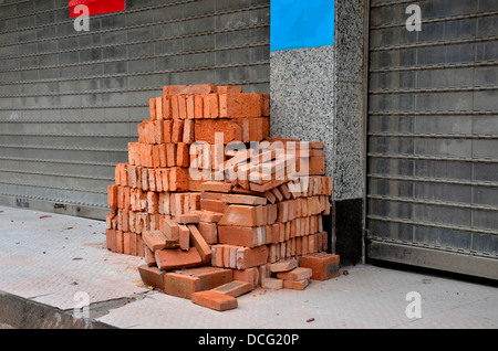 Pile of red bricks ready for construction Stock Photo