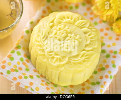 Traditional Chinese mid autumn festival food. Snowy skin mooncakes. The Chinese words on the mooncakes means lotus paste, not a logo or trademark. Stock Photo