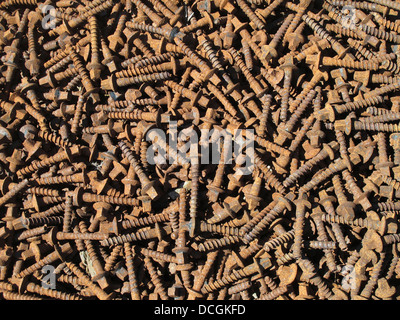 Rusty screws used for sleepers on railroad tracks Stock Photo